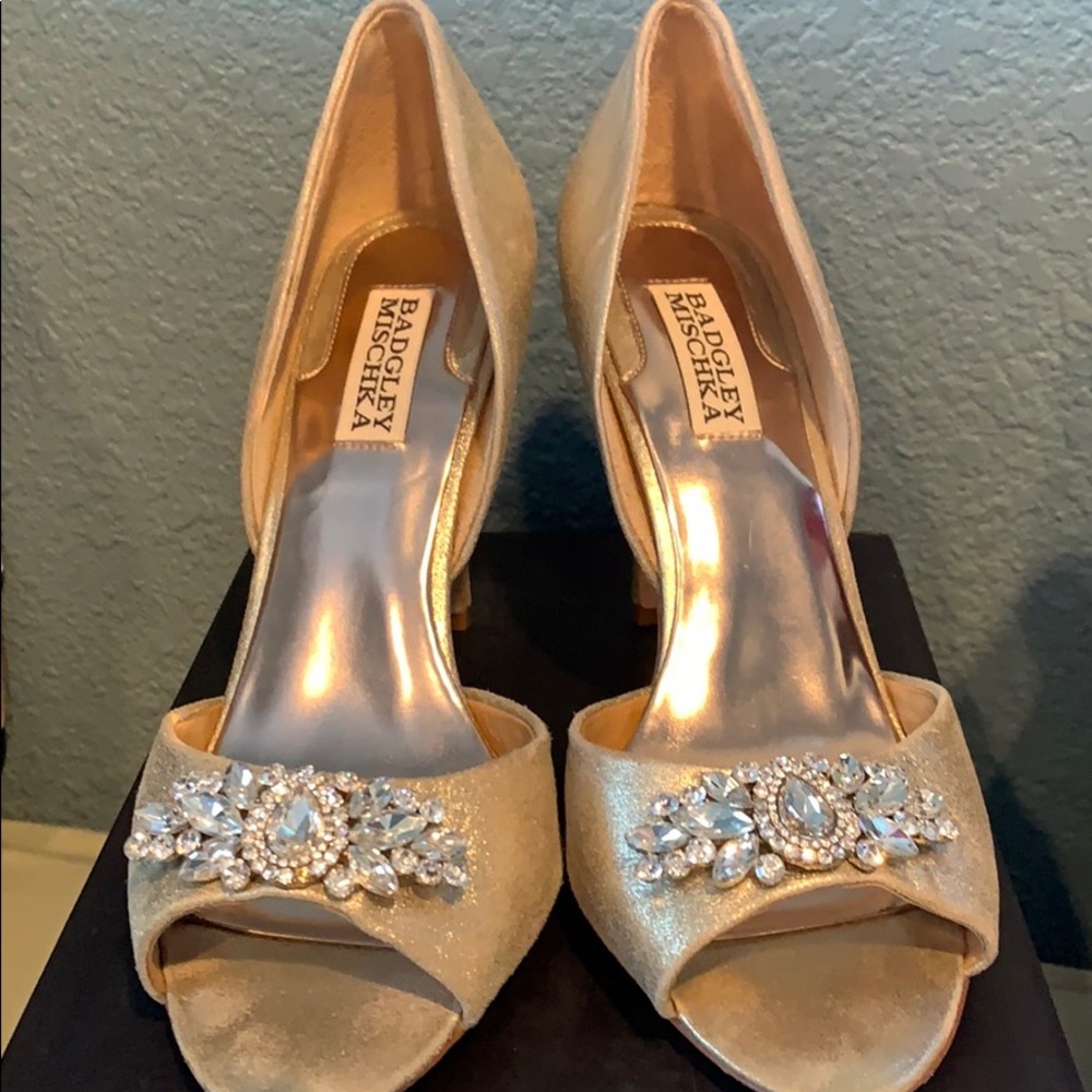 Gold open toe pumps